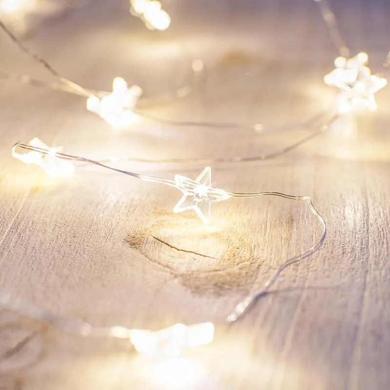 Visita la tienda de Lights4fun Lights4fun Guirnalda Luminosa con 40 Estrellas a Micro LED Blanco Cálido a Pilas con Temporizador Cadena de Luces Decoración para Interiores — Luces Navidad