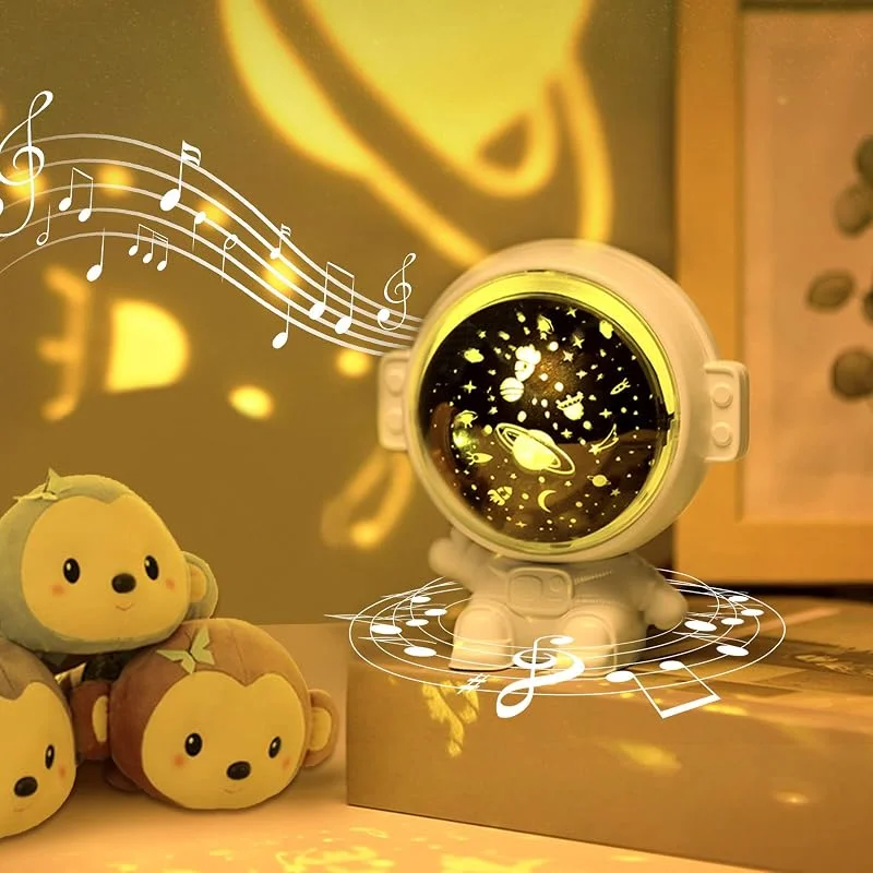 URAQT Astronaut Projector, Lampara Infantil Proyector con 3 Diapositivas y 4 Modos de Luz, 360° Rotación 8 Música Luz de Noche del Astronauta, Navidad Luces Regalo para Niños y Bebés — Luces Navidad